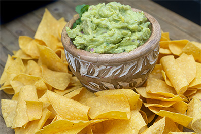 Chips and Guacamole, a starter dish that pairs perfectly with our Clementon burritos.