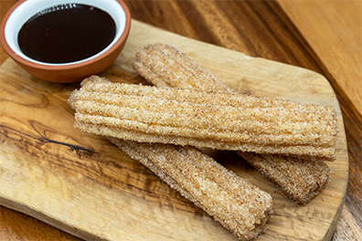 Churros with Chocolate Dipping Sauce, a dessert great to have after Clementon burritos.