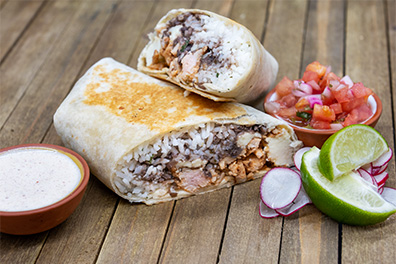 Chicken Burrito near Woodcrest, Cherry Hill, NJ, cut in half.
