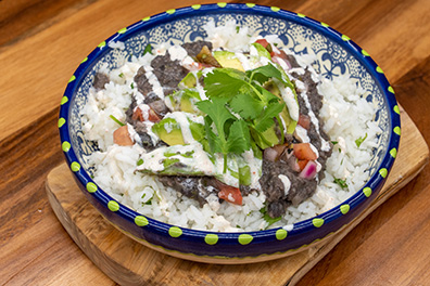 Rice bowl with avocado and steak made for delivery near Barrington, New Jersey.