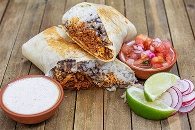 Split open burrito with rice and meat served at our Mexican food restaurant near Lawnside, NJ.