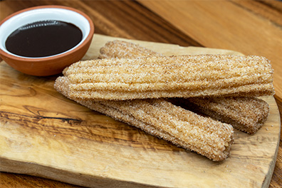 Churros with Chocolate Sauce prepared for Mexican restaurant delivery near Ashland, Cherry Hill.